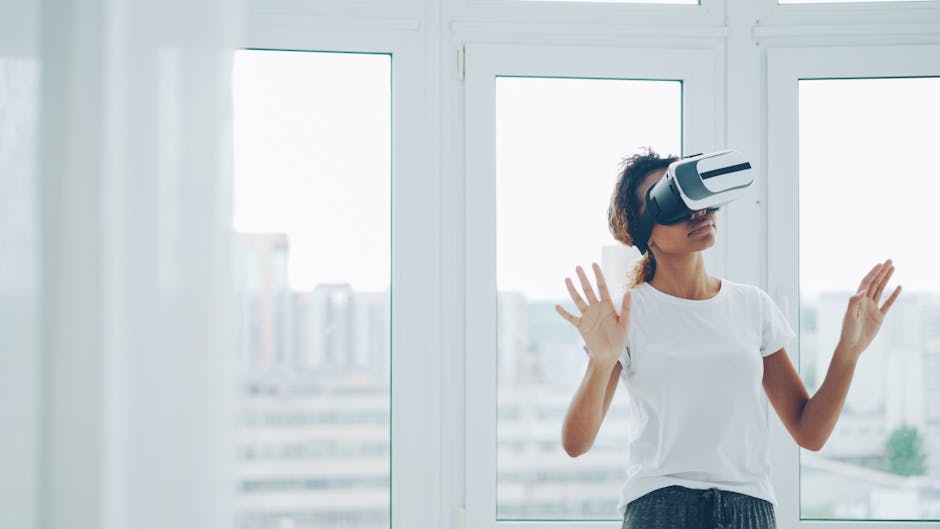 A woman enjoying a virtual reality experience with VR headset indoors